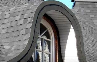 Installation of bituminous tiles